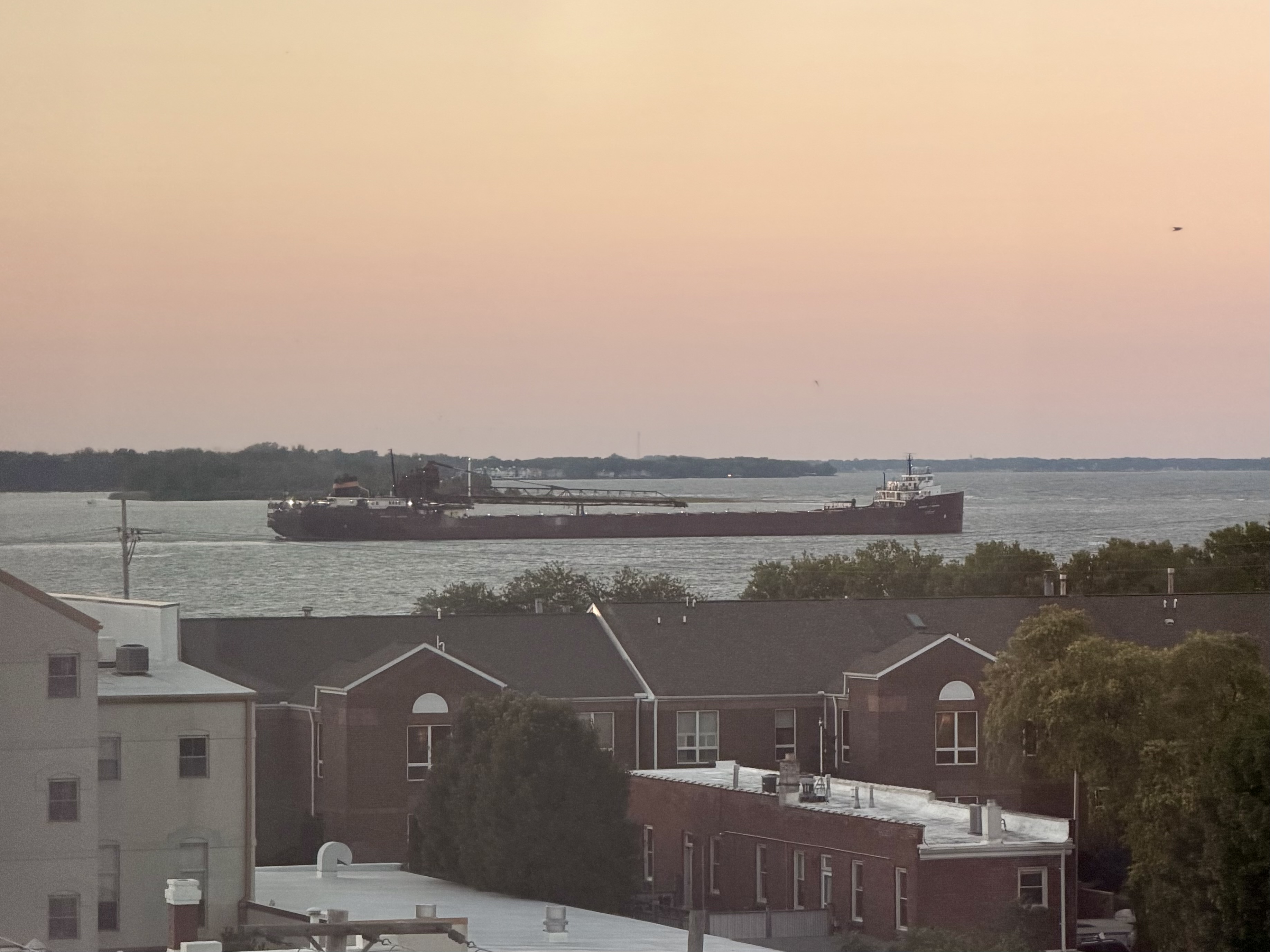 The sun sets over Sandusky Bay and the Herbert C. Jackson